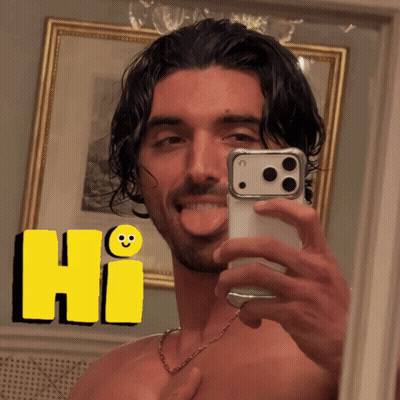 A Shirtless Man Is Taking A Selfie In Front Of A Mirror With A Yellow Hi Sticker Behind Him GIF