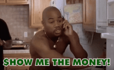A Shirtless Man Is Talking On A Cell Phone With The Words Show Me The Money Behind Him GIF