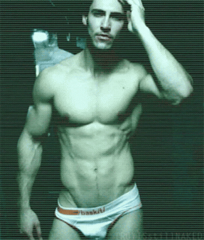A Shirtless Man Is Wearing A Pair Of White Underwear That Says Basketball GIF