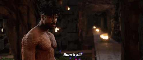 A Shirtless Man Says Burn It All In Front Of A Fire GIF