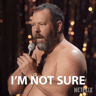 A Shirtless Man Speaking Into A Microphone With The Words I 'M Not Sure On The Bottom GIF