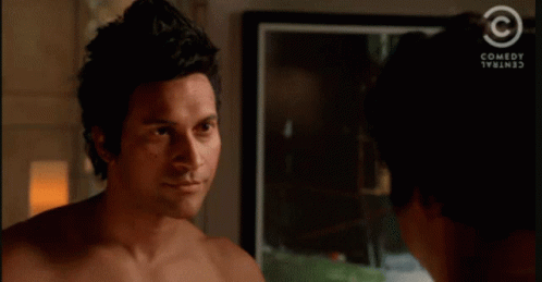 A Shirtless Man Talking To Another Shirtless Man With A Comedy Central Logo In The Corner GIF