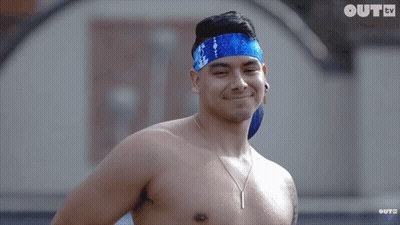 A Shirtless Man Wearing A Blue Headband Is Smiling In Front Of A Screen That Says Oute Tv GIF