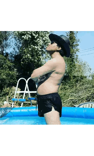 A Shirtless Man Wearing A Cowboy Hat And Shorts Is Standing In A Pool Sticker