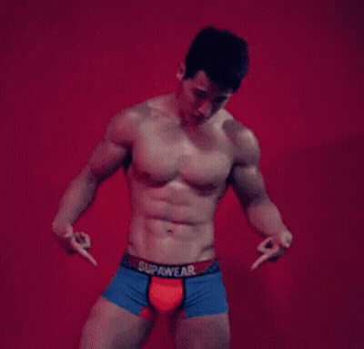 A Shirtless Man Wearing Blue And Red Boxer Shorts With The Word Supawear On The Waistband GIF