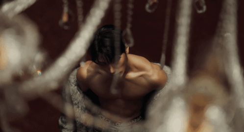 A Shirtless Man Wearing Dolce & Gabbana Underwear Looks Down GIF