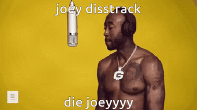 A Shirtless Man Wearing Headphones Stands In Front Of A Microphone With The Words Joey Disstrack Die Joeyyyy GIF