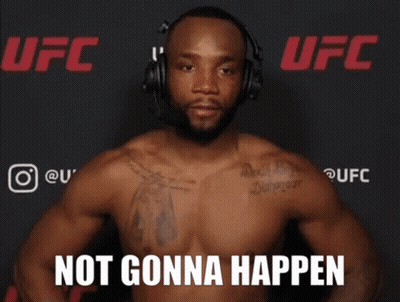 A Shirtless Man Wearing Headphones Stands In Front Of A Ufc Banner GIF