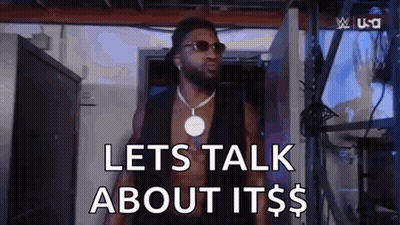 A Shirtless Man Wearing Sunglasses And A Necklace Is Standing In A Room And Saying `` Lets Talk About It $ '' . GIF