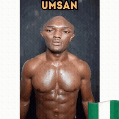 A Shirtless Man With A Bald Head Is Standing Next To A Green And White Flag . GIF