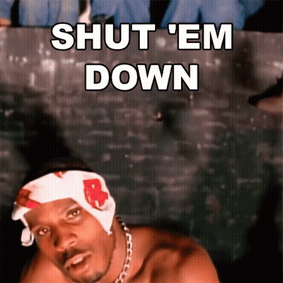 A Shirtless Man With A Bandana On His Head Says Shut 'Em Down GIF