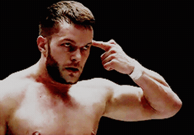 A Shirtless Man With A Beard Is Pointing His Finger At His Forehead GIF