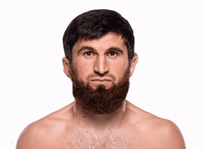 A Shirtless Man With A Beard Looks At The Camera With A Serious Look On His Face GIF