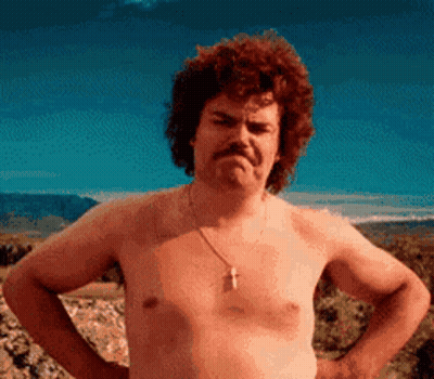 A Shirtless Man With A Moustache Is Standing With His Hands On His Hips . GIF
