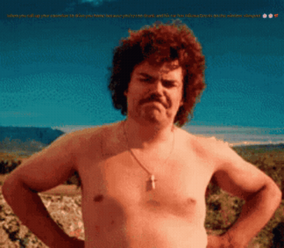 A Shirtless Man With A Mustache And A Cross Necklace GIF
