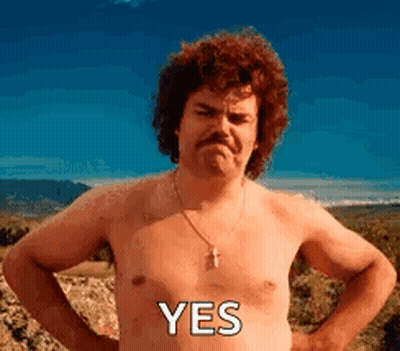 A Shirtless Man With A Mustache Is Standing With His Hands On His Hips And The Word Yes On His Chest . GIF