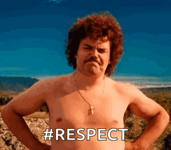 a shirtless man with a mustache is standing with his hands on his hips and the words `` respect '' written on his chest 
