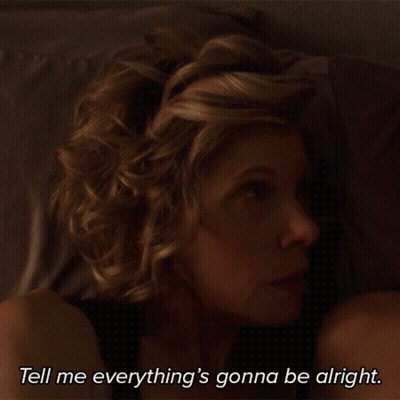 A Shirtless Man With A Mustache Says " Everything 'S Gonna Be Alright " In A Dark Room GIF