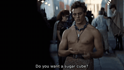 A Shirtless Man With A Necklace Says Do You Want A Sugar Cube GIF