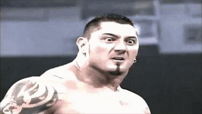 A Shirtless Man With A Tattoo On His Arm Is Making A Surprised Face GIF
