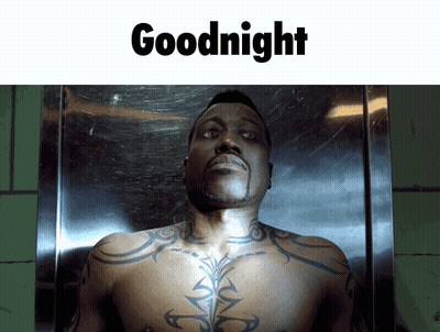 A Shirtless Man With A Tattoo On His Chest Is Laying In A Coffin With The Words Goodnight Below Him GIF