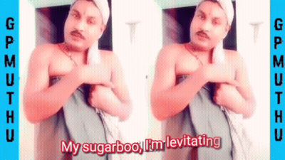 A Shirtless Man With A Towel Around His Head Is Standing In Front Of A Door . GIF