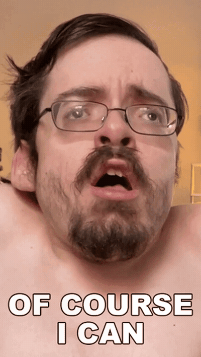 A Shirtless Man With Glasses And A Beard Has The Words Of Course I Can On His Face GIF