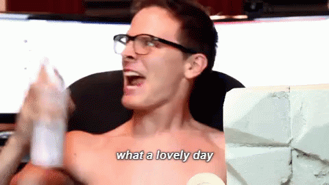 A Shirtless Man With Glasses Says " What A Lovely Day " In Front Of A Computer Screen GIF