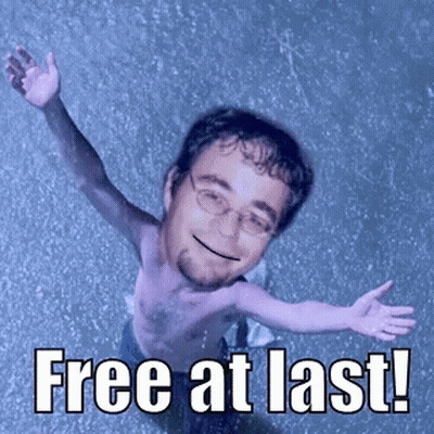 A Shirtless Man With His Arms Outstretched And The Words Free At Last Written Below Him GIF
