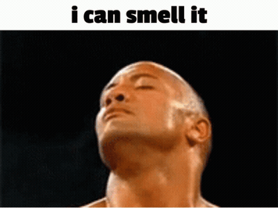 A Shirtless Man With His Eyes Closed And The Words " I Can Smell It " Below Him GIF