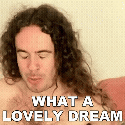 A Shirtless Man With Long Curly Hair Is Saying What A Lovely Dream GIF
