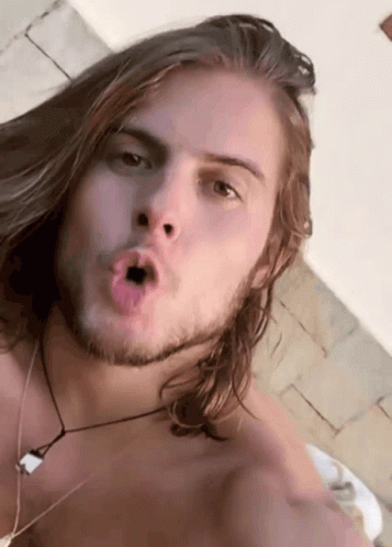 Man With Long Hair And Beard Making Funny Face GIF