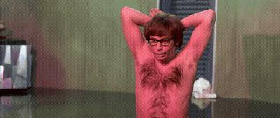 A Shirtless Man With Red Hair On His Chest And Glasses GIF