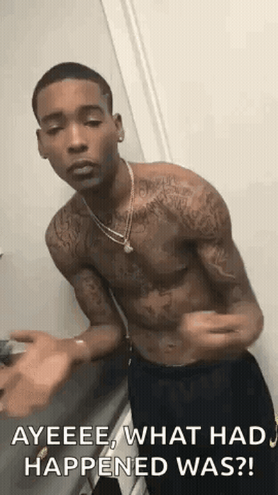 A Shirtless Man With Tattoos On His Arms And Chest Is Standing In A Room . GIF