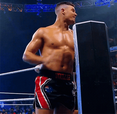 A Shirtless Wrestler In A Boxing Ring Is Wearing Shorts With The Word Wilde On The Side GIF