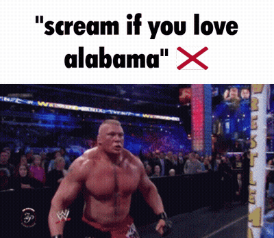 A Shirtless Wrestler Is Screaming In Front Of A Crowd With The Words " Scream If You Love Alabama " GIF