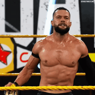 A Shirtless Wrestler Is Standing In A Wrestling Ring With The Word Choccy Wrestling On The Bottom Right GIF