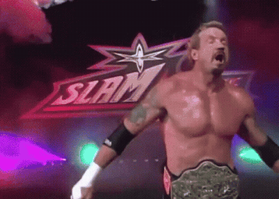 A Shirtless Wrestler Is Standing In Front Of A Sign That Says Slam GIF