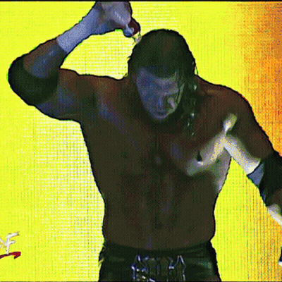 A Shirtless Wrestler Is Standing In Front Of A Yellow Background With A Wwe Logo In The Corner GIF