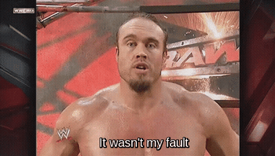A Shirtless Wrestler Says " It Wasn 'T My Fault " In Front Of A Wrestling Ring GIF