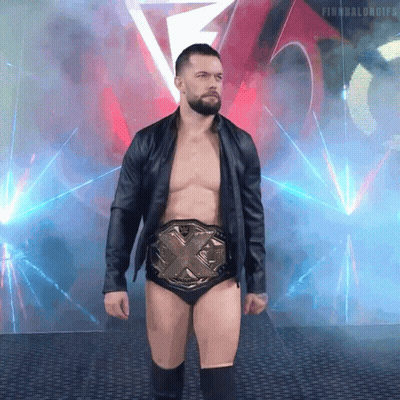 A Shirtless Wrestler Wearing A Belt With The Letters X On It GIF