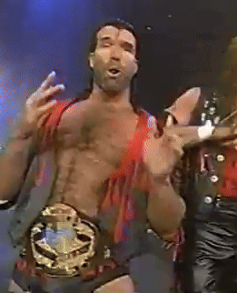 A Shirtless Wrestler With A Belt Around His Waist Is Dancing GIF