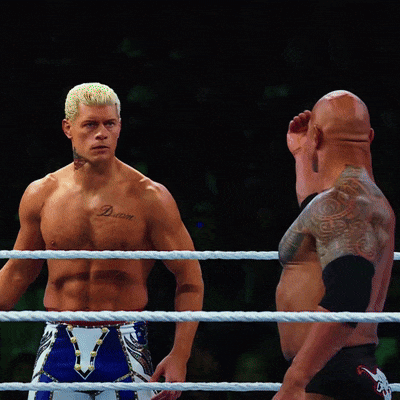 A Shirtless Wrestler With A Tattoo On His Chest That Says Deluxe GIF