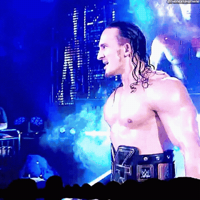 A Shirtless Wrestler With A Wrestling Belt That Says ' Tna ' On It GIF