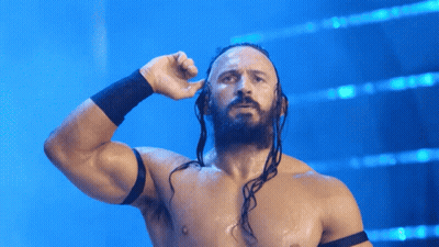 A Shirtless Wrestler With Dreadlocks And A Black Band Around His Wrist GIF