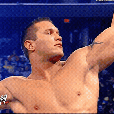 A Shirtless Wrestler With The Word W On His Arm GIF