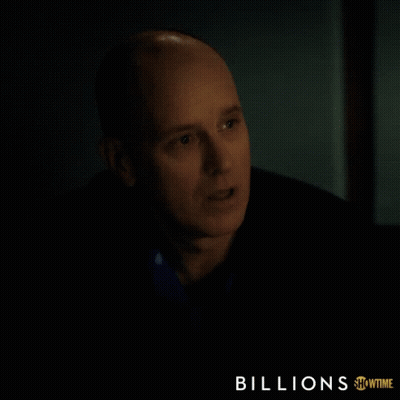 A Showtime Ad For Billions Features A Bald Man In A Dark Room GIF