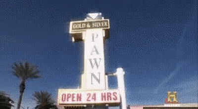 A Sign For A Pawn Shop That Is Open 24 Hrs GIF