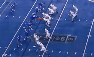A Sign For Goldy 'S Breakfast Hangs Over A Football Field GIF