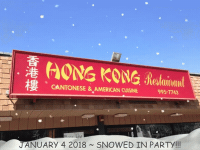 A Sign For The Hong Kong Restaurant Is Covered In Snow GIF